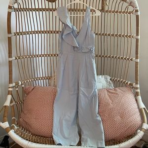 Saints and secrets blue jumpsuit with ruffles